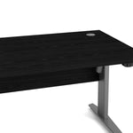 Prima Desk 150 cm in Black woodgrain with Height adjustable legs with electric control in Silver grey steel